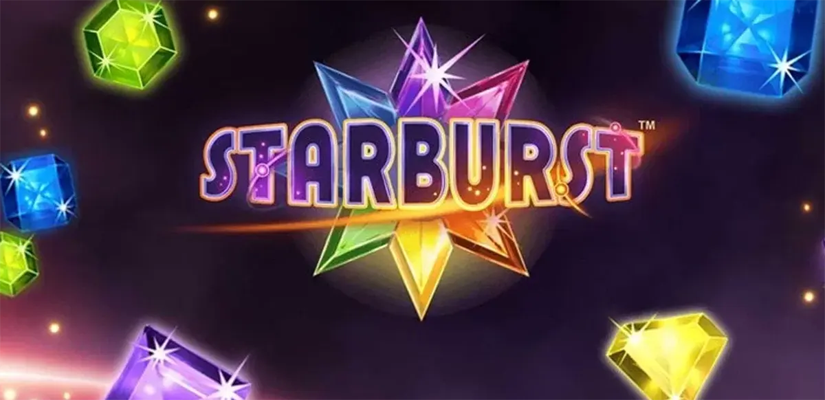 Starburst slot logo on a dark space-themed background, with a multicoloured star-shaped gemstone behind the title and glowing gems floating around the edges.